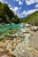 Turquoise colored soça river near Kozjak waterfall (Slovenia)