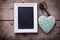 Turquoise decorative heart, empty blackboard and vintage key