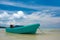 Turquoise fisherman boat on the beach