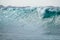 Turquoise giant wave strike against shallow wate