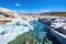 turquoise hot spring surrounded by white mineral deposits