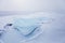 Turquoise ice floe. Winter landscape of Baikal lake