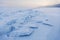 Turquoise ice floes. Winter sunset landscape.