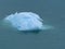 A Turquoise Iceberg Floating on Sea