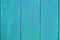 Turquoise light blue vertical wooden planks background texture, close up. Shabby chic background