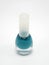 Turquoise nail polish with brush inside in the bottle