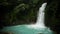 Turquoise Natural Tropical Waterfall and Pool in Rainforest