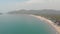 Turquoise ocean shore in Palolem Beach in southern Goa, India - Aerial Wide shot