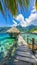 Turquoise ocean with wooden walkway leading to overwater bungalows at tropical resort