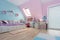 Turquoise and pink childrens room with a study desk