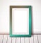 Turquoise rectangular frame on a white brick wall