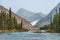 Turquoise river and glacier on a background