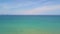 Turquoise sea and blue sky aerial view from flying drone. Beautiful landscape blue ocean and skyline drone view.