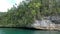 Turquoise Sea And Rocks With Green Tropical Trees In Triton Bay In Kaimana Islands. Wide Angle Of Wild Nature: Pacific Lagoon.