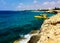 Turquoise sea water with grey natural stones. Purity ripple ocean water surface with selective focus and sun light. Transparent