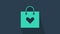 Turquoise Shopping bag with heart icon isolated on blue background. Shopping bag shop love like heart icon. Valentines