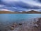 Turquoise steppe lake on a beautiful cloudy evening