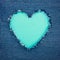 Turquoise vintage heart on blue denim fabric