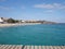 Turquoise waters of Atlantic Ocean landscape and pier at african town of Santa Maria on Sal island in Cape Verde