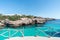 Turquoise waters of Cala en Brut, beach of Minorca, Balearic Islands in Spain