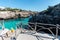 Turquoise waters of Cala en Brut, beach of Minorca, Balearic Islands in Spain