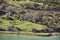 Turquoise waters reservoir and mountain landscape in Riano. Spain