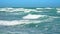 Turquoise wave rolling in the sea, Cheltenham Beach, Auckland, New Zealand