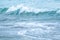 Turquoise waves across expansive frame of ocean, creating mesmerizing seascape. deep azure sea stretches to horizon, showcasing