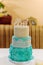 Turquoise wedding cake with beige decor