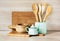 Turquoise and wooden vintage crockery, tableware, dishware utensils and stuff on wooden table-top. Kitchen still life as backgroun