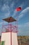 turret with red flag on the beach