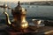 turrkish coffee served in a traditional brass pot, with view of the bosphorus
