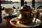 turrkish coffee served in a traditional brass pot, with view of the bosphorus