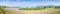 Tuscan countryside with plowed fields on foreground - Panoramic view obtained by stitching several images  Italy-Tuscany-Pisa