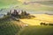 Tuscan house on the misty hill in Val d\'Orcia, Italy.