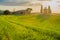 Tuscan landscape with a chapel at sunset