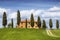 Tuscan landscape with farmhouse and cypress trees