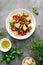 Tuscan Panzanella salad with tomatoes, basil and bread, top view