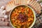 Tuscan ribollita soup close up in a bowl. horizontal top view