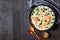 Tuscan salmon on a dark wooden table, copy space