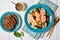 Tuscan salmon stew with rye bread, top view