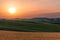 The Tuscan sunset highlights the most beautiful natural colors of the region. Yellow field in the foreground, a green meadow