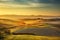 Tuscany countryside misty panorama, rolling hills and green field