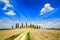 Tuscany, farmland, cypress trees and white road. Siena, Val d Orcia, Italy.