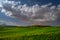 Tuscany full moon night landscape in the spring time with green field