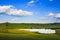 Tuscany, lake, tree and green fields, rural landscape on sunset, Italy.