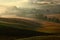 Tuscany landscape with fog. Sunrise morning in Tuscany landscape. Idyllic view of hilly farmland in Tuscany in beautiful morning