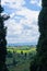 Tuscany landscape framed by two huge cypress trees, near San Gimignano