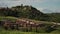 Tuscany landscape with meadows, Italian village and medieval Monticchiello town