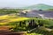 Tuscany landscape at sunrise. Tuscan farm house, vineyard, hills.